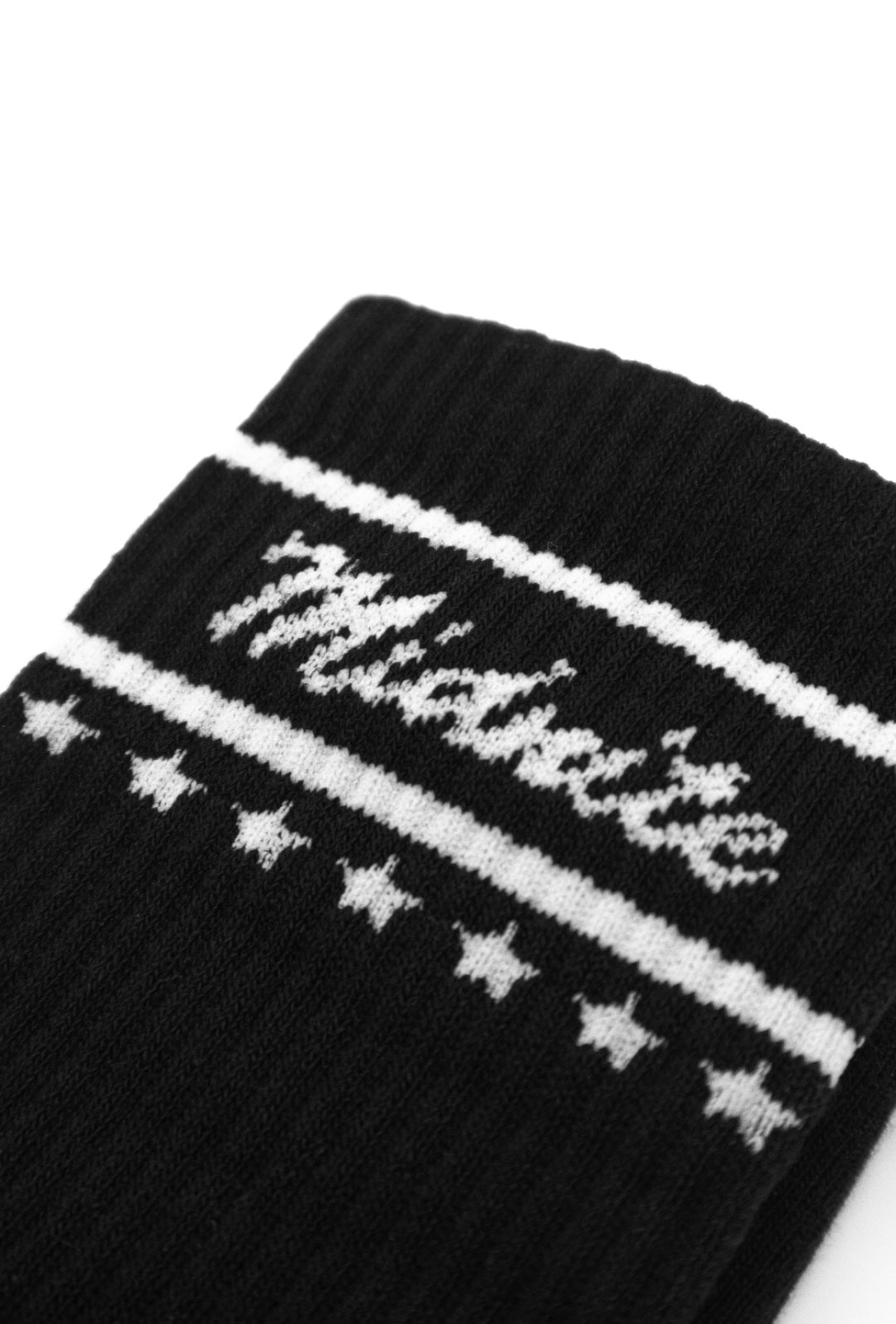 Midnite Club black streetwear socks – athletic crew style with white embroidered script logo and star band, designed for comfort and motorsport-inspired fashion.