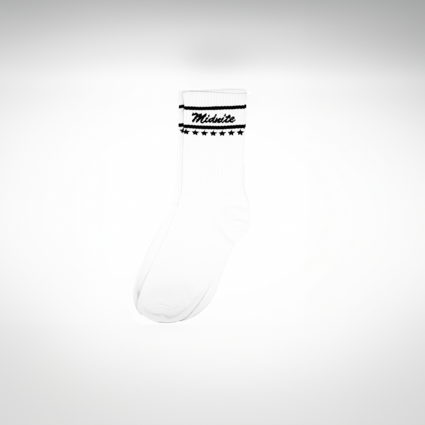 Midnite Club white streetwear socks – ribbed athletic crew socks with black cursive logo and star detailing, inspired by retro motorsport and underground fashion.