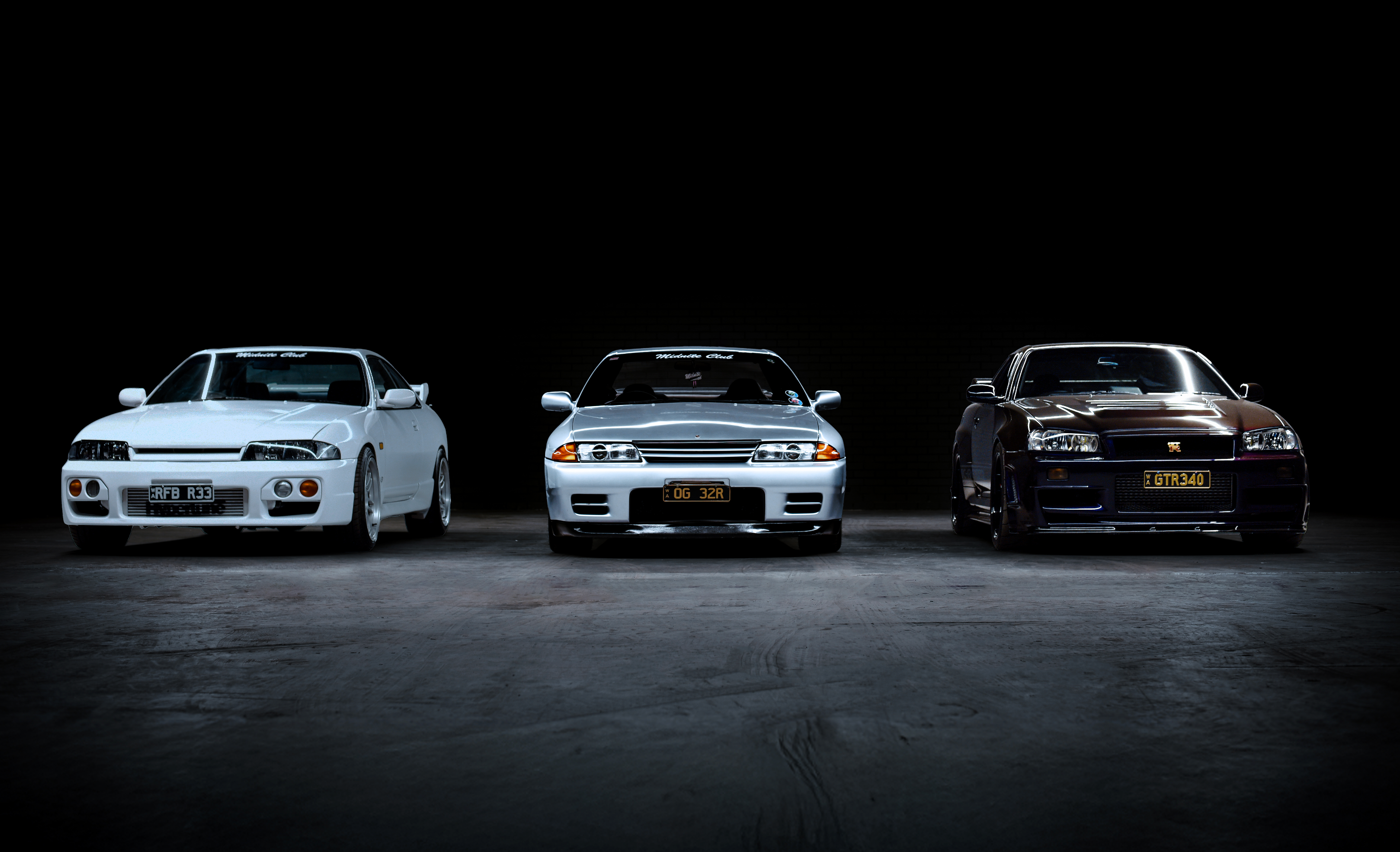Nissan GT-R R33, R32, and R34 tuner cars parked in underground garage – Perth car scene by Midnite Club Australia.