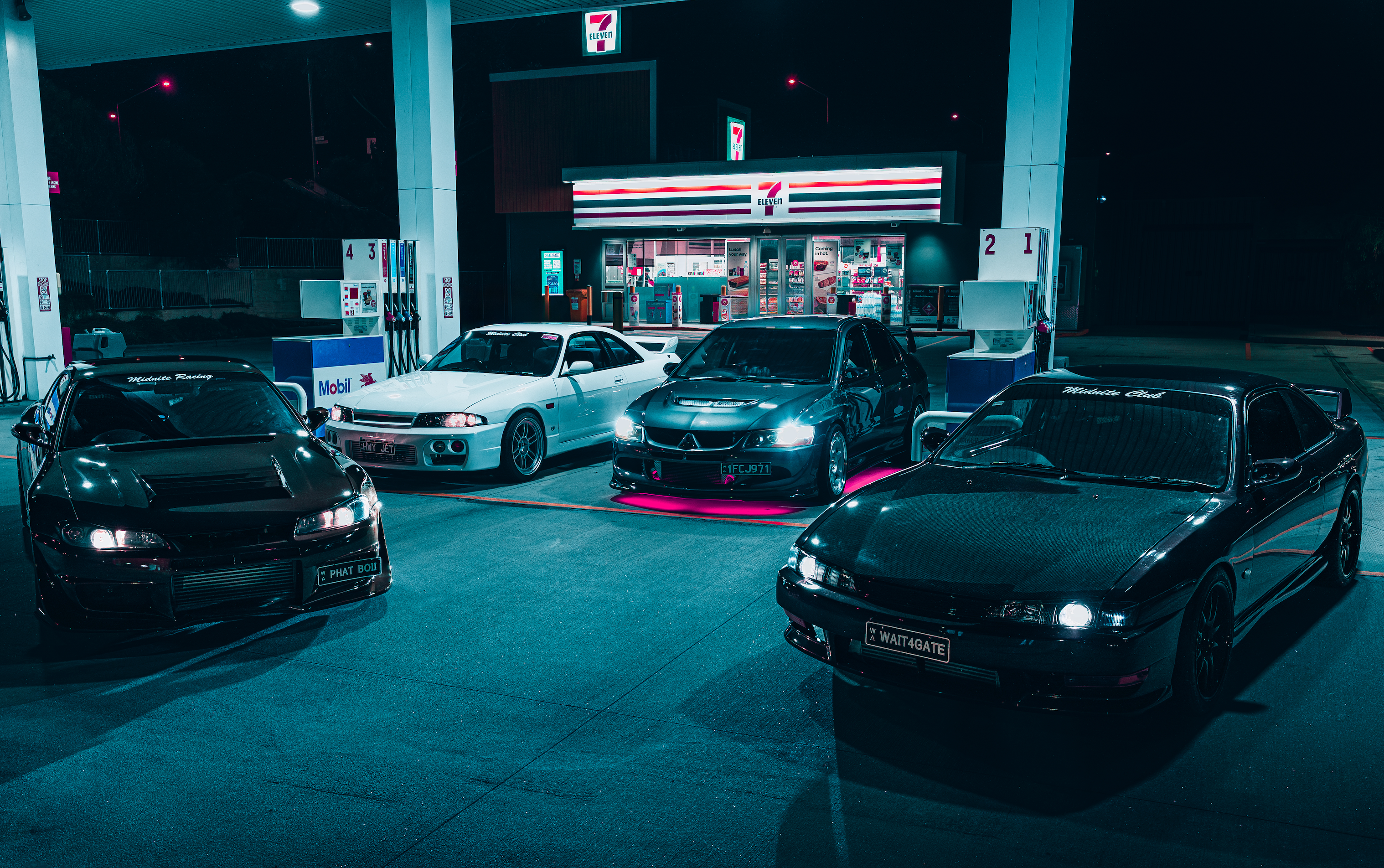 Perth tuner cars gathered at 7-Eleven petrol station at night – Nissan Silvia, Skyline R33, Mitsubishi Evo with underglow – captured by Midnite Club Australia.